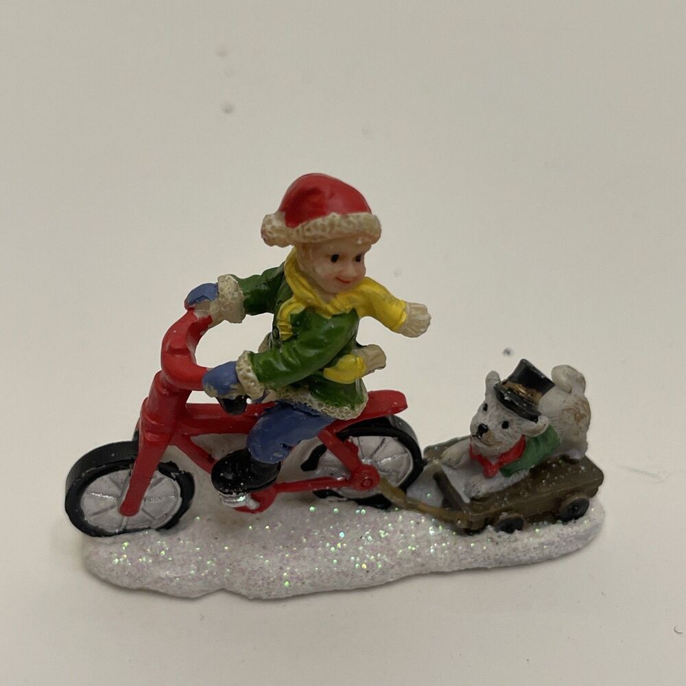 Celebrations Christmas Village Snowy Boy On Bike With Dog 2” Tall Glittery Snow